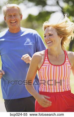 A middle-aged couple jogging View Large Photo Image Stock Photography - A middle-aged couple jogging. Fotosearch