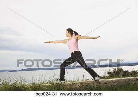 Young woman working out in scenic surroundings View Large Photo Image Stock Image - Young woman working out in scenic surroundings. Fotosearch