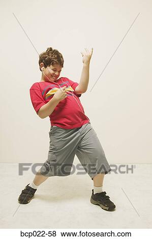 A boy playing the air guitar View Large Photo Image Stock Photo - A boy playing the air guitar. Fotosearch
