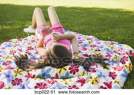A young girl using a PDA View Large Photo Image Stock Image - A young girl using a PDA. Fotosearch