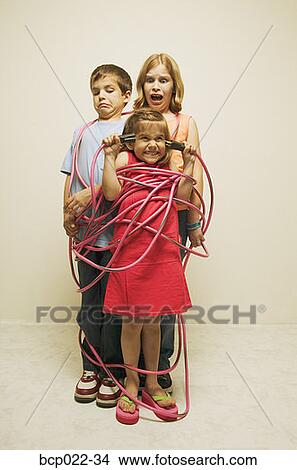 Three totally wired children View Large Photo Image Picture - Three totally wired children. Fotosearch