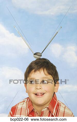 Young boy with antennae coming out of his head View Large Photo Image Stock Photograph - Young boy with antennae coming out of his head. Fotosearch