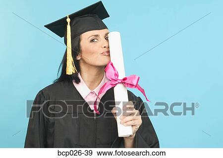A female graduate kissing her diploma View Large Photo Image Stock Photo - A female graduate kissing her diploma. Fotosearch