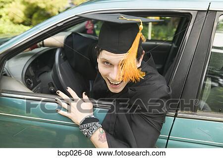 Graduate wearing a cap and gown View Large Photo Image Stock Photo - Graduate wearing a cap and gown. Fotosearch
