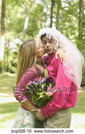 Husband wearing wedding veil View Large Photo Image Stock Image - Husband wearing wedding veil . Fotosearch