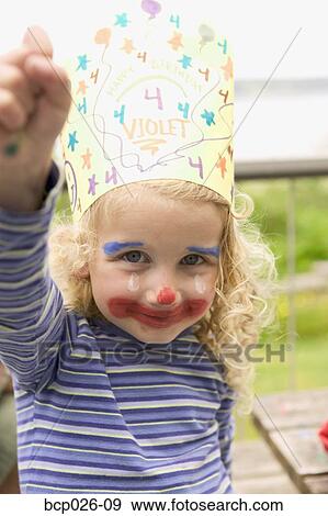 Stock Photo - Little girl celebrating her fourth birthday. Fotosearch