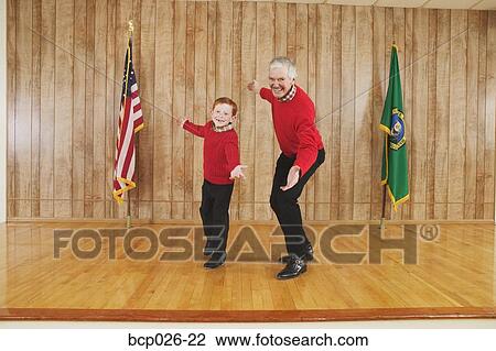 Young boy and man dancing on stage View Large Photo Image Stock Image - Young boy and man dancing on stage. Fotosearch