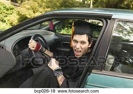 Young graduate wearing a cap and gown View Large Photo Image Stock Photo - Young graduate wearing a cap and gown. Fotosearch