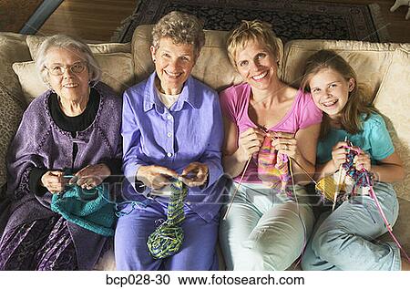 Stock Image - Four generations of females knitting. Fotosearch