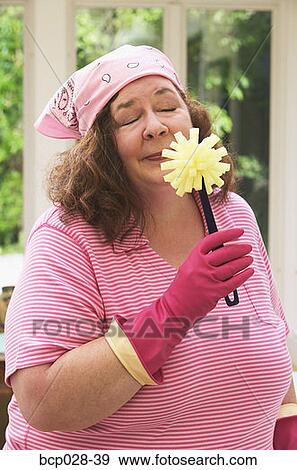 Housewife savoring the essence of dish washing View Large Photo Image Stock Photo - Housewife savoring the essence of dish washing. Fotosearch