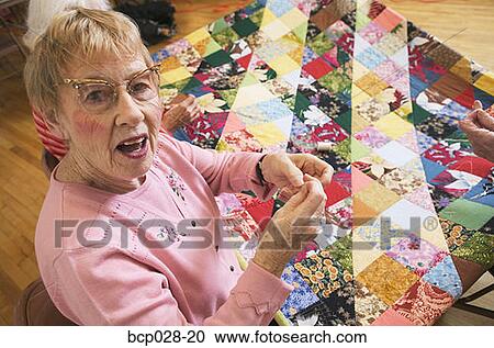 Portrait of a woman quilting View Large Photo Image Stock Image - Portrait of a woman quilting. Fotosearch
