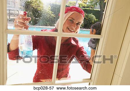 Woman cleaning windows View Large Photo Image Stock Photo - Woman cleaning windows. Fotosearch