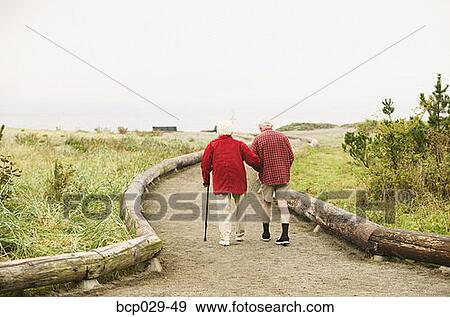 An elderly couple out for a walk View Large Photo Image Stock Photo - An elderly couple out for a walk. Fotosearch