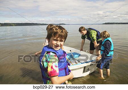 Stock Photo - Father and kids going boating. Fotosearch