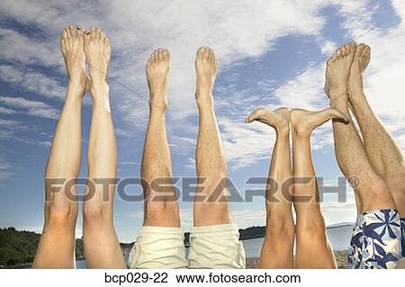 Stock Image - Legs and feet up in the air. Fotosearch