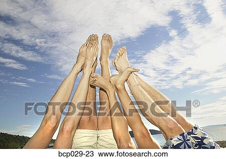 Stock Image - Legs and feet up in the air. Fotosearch