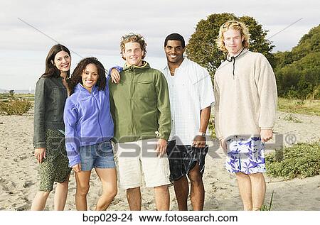 Portrait of friends at the beach View Large Photo Image Picture - Portrait of friends at the beach. Fotosearch