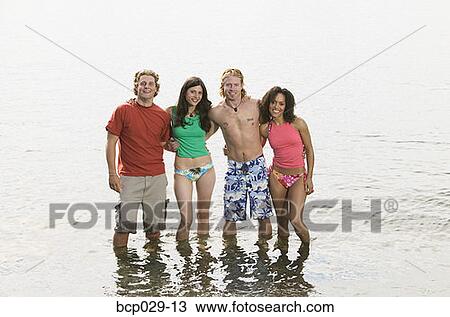 Portrait of friends at the beach View Large Photo Image Stock Image - Portrait of friends at the beach. Fotosearch