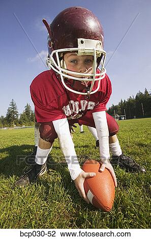 Stock Image - Closeup of a young football player. Fotosearch