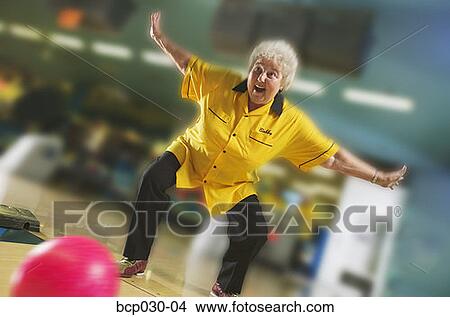 Female bowler rolls a great game View Large Photo Image Picture - Female bowler rolls a great game. Fotosearch