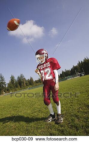 Football player about to get hit with ball View Large Photo Image Stock Photo - Football player about to get hit with ball. Fotosearch