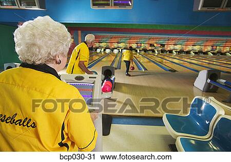 Senior teammates bowling together View Large Photo Image Stock Image - Senior teammates bowling together. Fotosearch