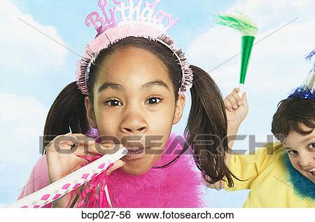 Boy and girl in party hats View Large Photo Image Stock Photograph - Boy and girl in party hats. Fotosearch
