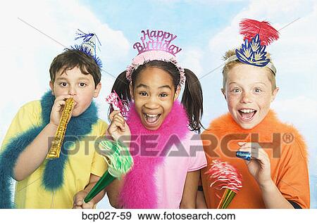 Stock Photo - Boys and girl in party hats. Fotosearch