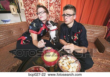Couple at home having fondue View Large Photo Image Stock Image - Couple at home having fondue. Fotosearch
