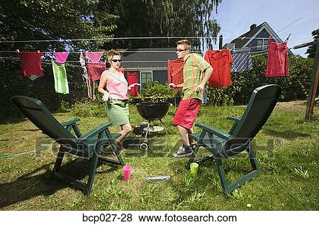 Couple dancing in the backyard View Large Photo Image Stock Photo - Couple dancing in the backyard. Fotosearch