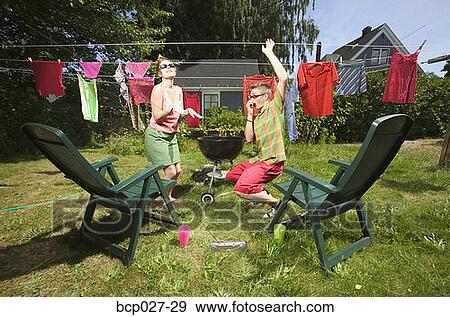 Couple dancing in the backyard View Large Photo Image Stock Photo - Couple dancing in the backyard. Fotosearch