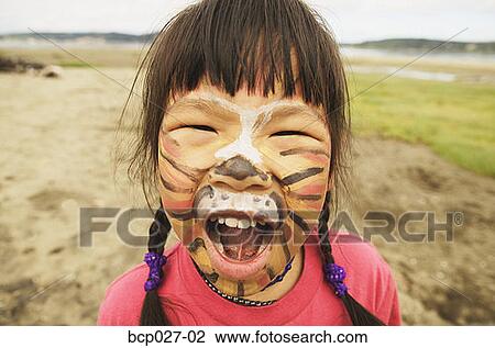 Girl with painted face roaring like a tiger View Large Photo Image Stock Image - Girl with painted face roaring like a tiger. Fotosearch