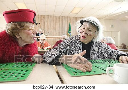 Pair of women playing bingo View Large Photo Image Picture - Pair of women playing bingo. Fotosearch