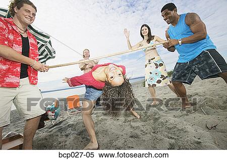 Stock Photography - People at a beach party. Fotosearch