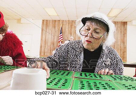 Woman playing bingo View Large Photo Image Stock Image - Woman playing bingo. Fotosearch