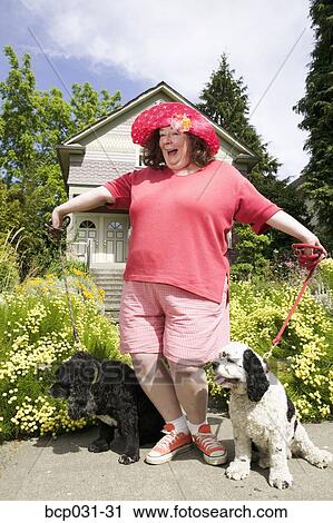 Woman posing with Cocker Spaniels View Large Photo Image Stock Image - Woman posing with Cocker Spaniels. Fotosearch