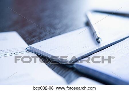 Close-up of checkbook and pen View Large Photo Image Stock Photo - Close-up of checkbook and pen. Fotosearch