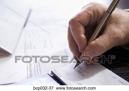 Closeup of man writing out a check View Large Photo Image Stock Photo - Closeup of man writing out a check. Fotosearch