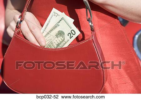 Woman holding American currency View Large Photo Image Stock Image - Woman holding American currency. Fotosearch