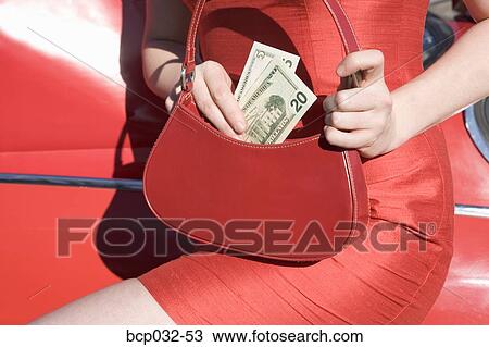 Woman holding American currency View Large Photo Image Stock Image - Woman holding American currency. Fotosearch