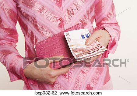 Woman holding euro banknotes View Large Photo Image Stock Image - Woman holding euro banknotes. Fotosearch