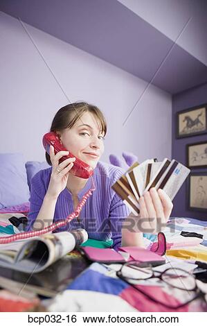 Woman on phone holding credit cards View Large Photo Image Stock Photograph - Woman on phone holding credit cards. Fotosearch
