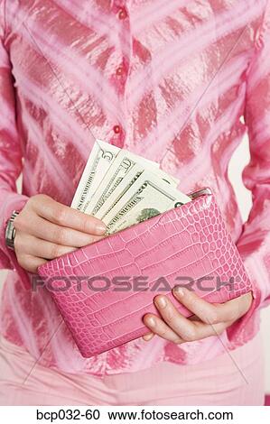 Woman removing American currency from purse View Large Photo Image Stock Image - Woman removing American currency from purse. Fotosearch