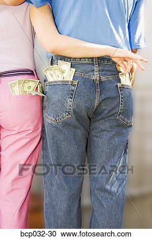Woman taking money from man's pocket View Large Photo Image Stock Image - Woman taking money from man's pocket. Fotosearch
