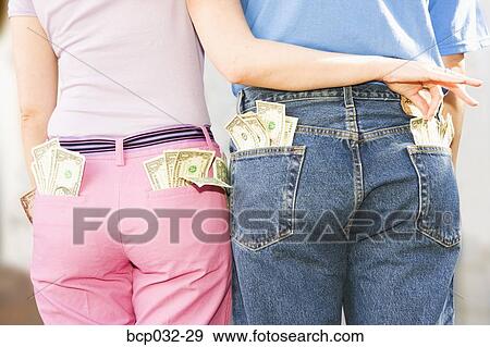 Woman taking money from man's pocket View Large Photo Image Stock Photo - Woman taking money from man's pocket. Fotosearch