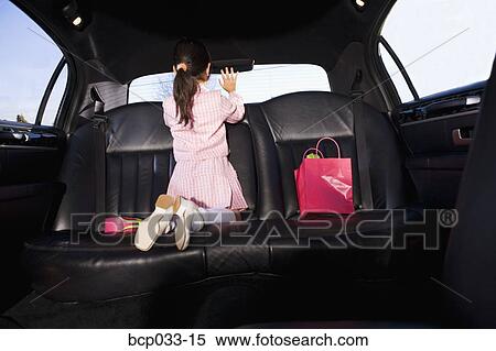Girl in car waving goodbye View Large Photo Image Stock Photography - Girl in car waving goodbye. Fotosearch