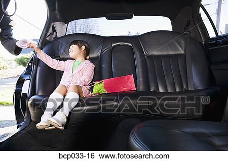 Girl sitting in limousine View Large Photo Image Stock Photograph - Girl sitting in limousine. Fotosearch