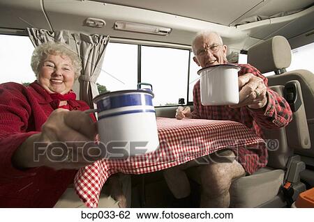Stock Image - Senior couple enjoying the morning. Fotosearch