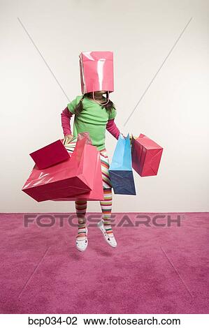 Jumping girl with shopping bags View Large Photo Image Stock Image - Jumping girl with shopping bags. Fotosearch