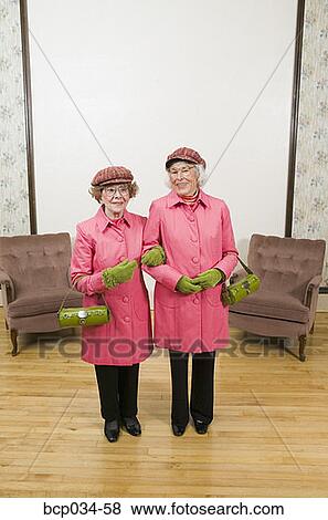 Senior women dressed alike View Large Photo Image Stock Photo - Senior women dressed alike. Fotosearch